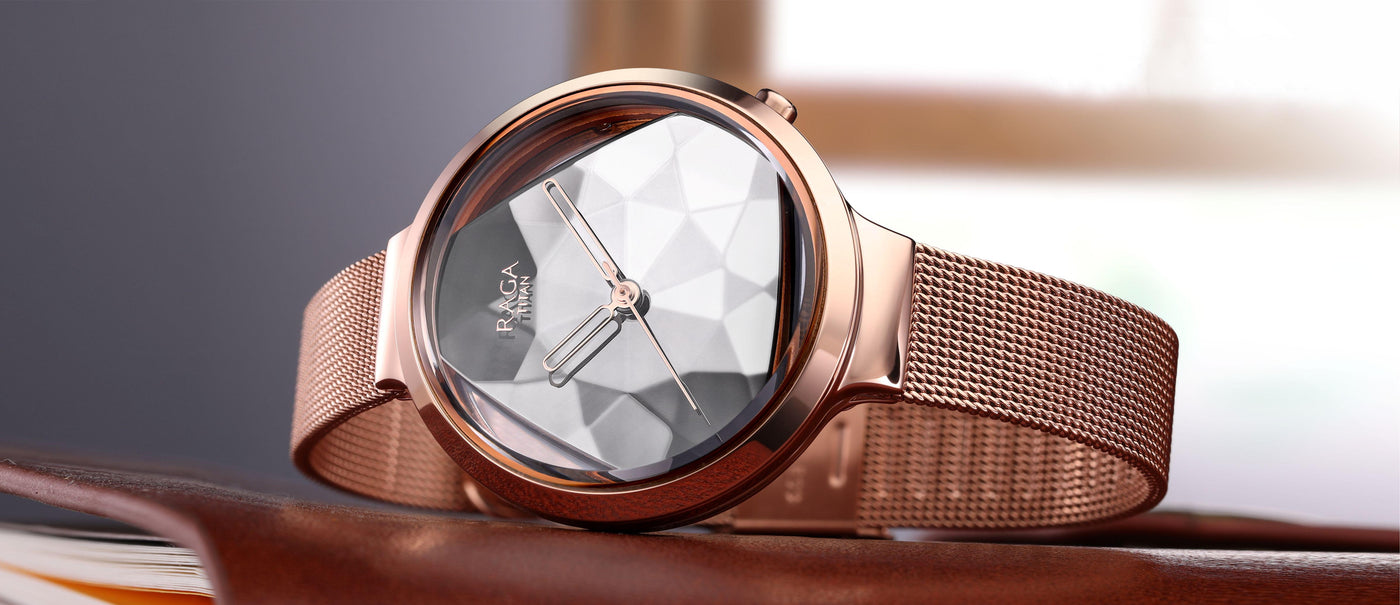 Large brown and metallic titan raga watch