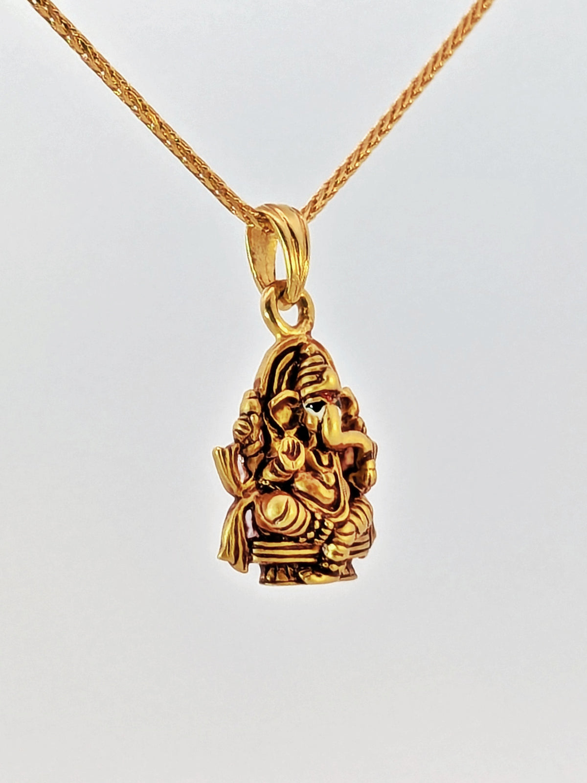 22K Yellow Gold Seated Lord Ganesh Antique-Finish Devotional Pendant