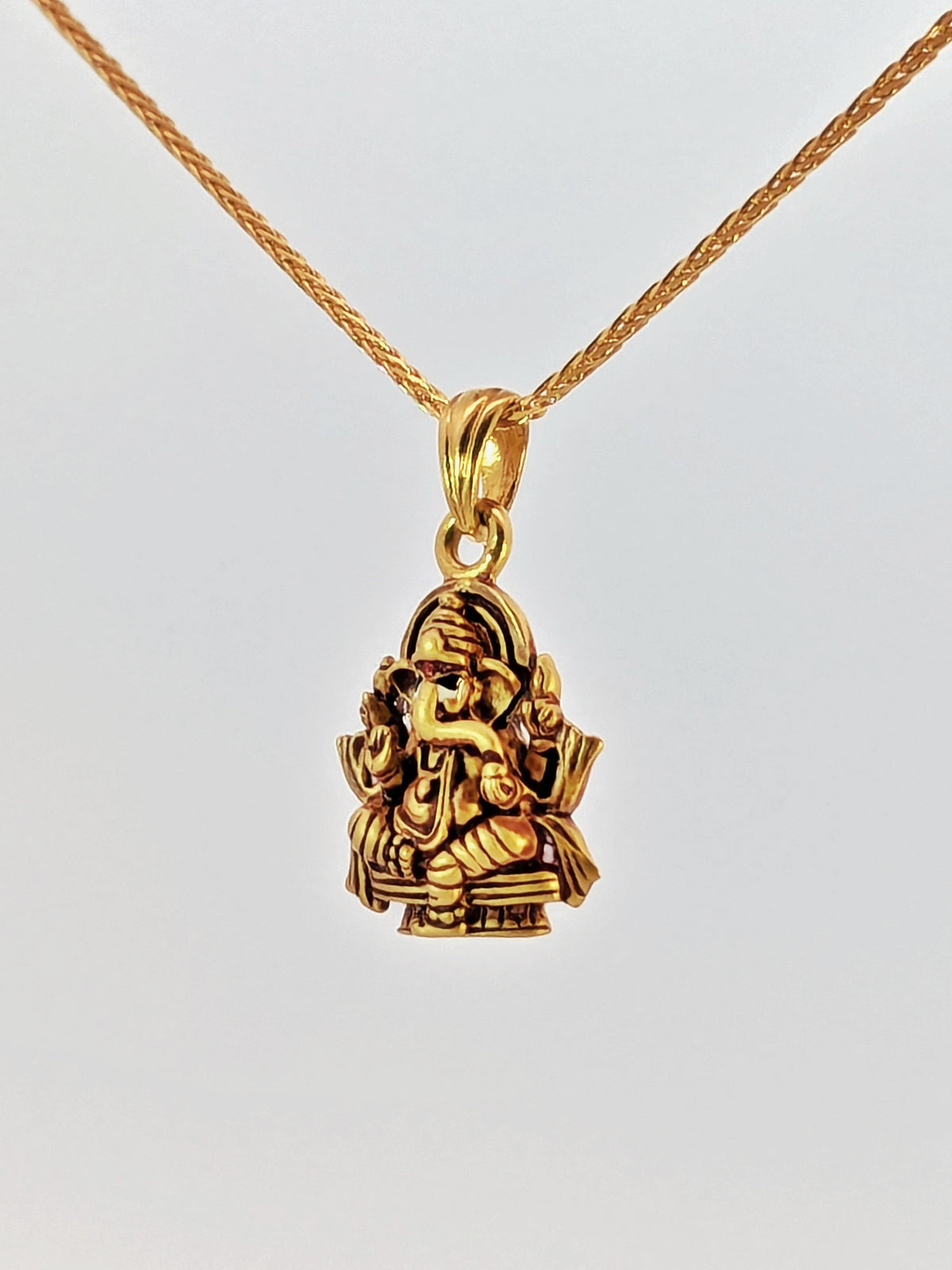 22K Yellow Gold Seated Lord Ganesh Antique-Finish Devotional Pendant